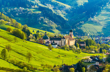 Beautiful mountain landscape with monastery in village. Germany, Black forest, 