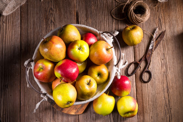 Naklejka na ściany i meble Fresh autumn apples in the basket