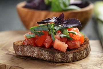 homemade bruschetta with tomatoes, basil and leek