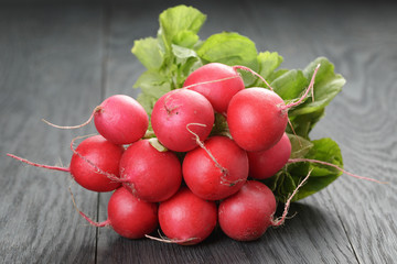 freshly harvested radishes on rustic table