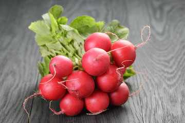 freshly harvested radishes on rustic table