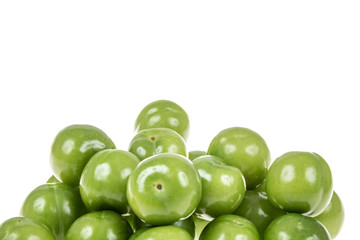 green plums on white