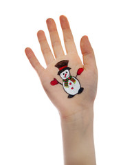 Child's hand with painted Christmas symbol 