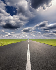 Driving on an empty asphalt road at idyllic sunny day