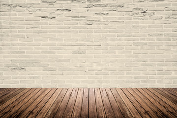 Old interior room with brick wall and wood floor