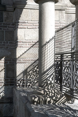 entrance of a graveyard with a closed wrought-iron gate