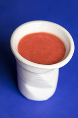 strawberry smoothie in a ceramic bowl