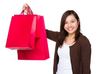 Fototapeta na wymiar Asian woman holding with shopping bag