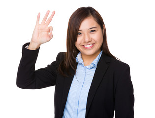 Businesswoman with ok sign gesture