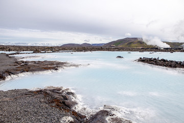 Fototapeta premium The lagoon is a man-made lagoon which is fed by the water output of the nearby geothermal power plant Svartsengi