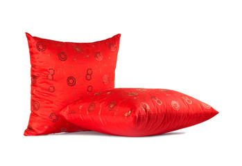 two red decorative pillows with pattern