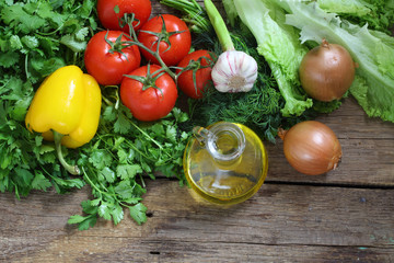 Fresh vegetables: tomatoes, pepper, an onions, garlic, a coriand