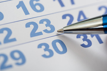 Close-up Of Calendar And Pen