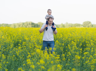 family from three people on a rape field