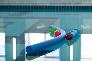 balls and tubes in clear water pool