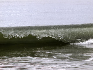 Close Shot Of Ocean Wave Curling Over