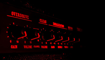 guitar amplifier control panel in red light - obrazy, fototapety, plakaty