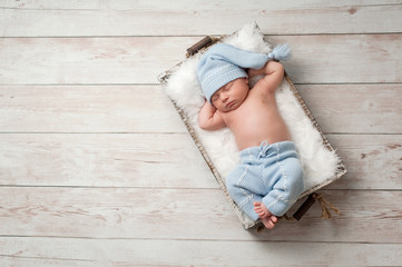 Sleeping Newborn Baby Wearing Pajamas