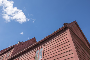 Red old house in sunlight.