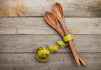 Measure tape with kitchen utensils. Diet food