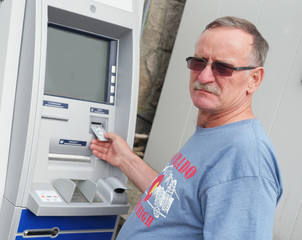 Fototapeta na wymiar man withdrawing money