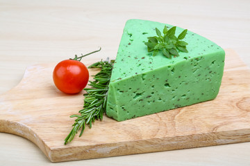 Green pesto cheese and basil leaves