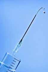 syringe with drops on needle