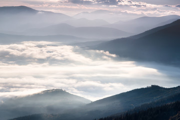 Landscape misty mountains in the morning sunlight.