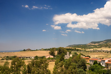 Fototapeta na wymiar Sardegna, Barumini, panorama del paese e nuraghe, Italia