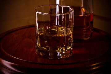 whiskey glass on wooden tray