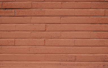 Old empty brick wall background, plaster falling off
