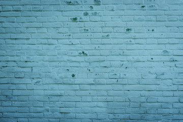 The brick texture with cracks and scratches can be used as a background