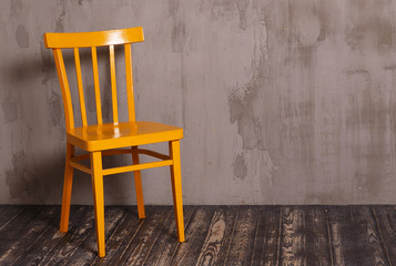 Yellow wooden chair in nterior room