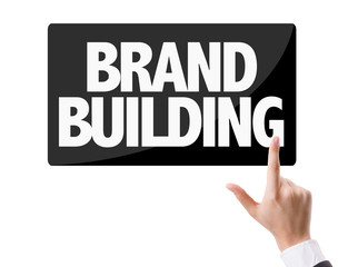 Businessman pressing button with the text: Brand Building