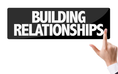 Businessman pressing button: Building Relationships
