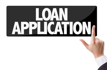 Businessman pressing button with the text: Loan Application