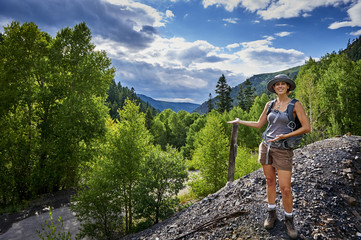 young woman hiking in the mountains