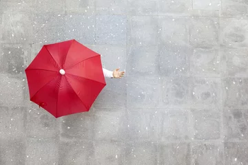 Fotobehang Man holding a red umbrella © cristovao31