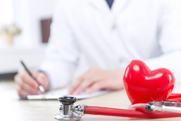 Nice doctor filling the papers 