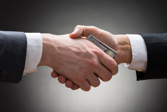 Businesspeople Hands With Money