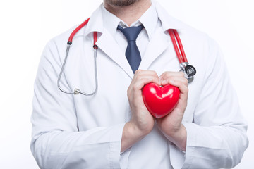 Nice cardiologist holding heart