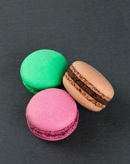 macarons on black stone background