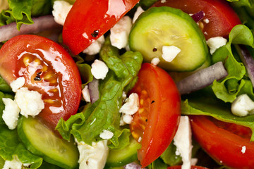 Salad. Mediterranean Salad with Feta Cheese on a white background. Selective focus.