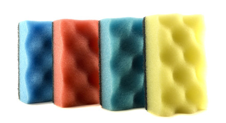 Colored sponges for cleaning and washing dishes isolated on white