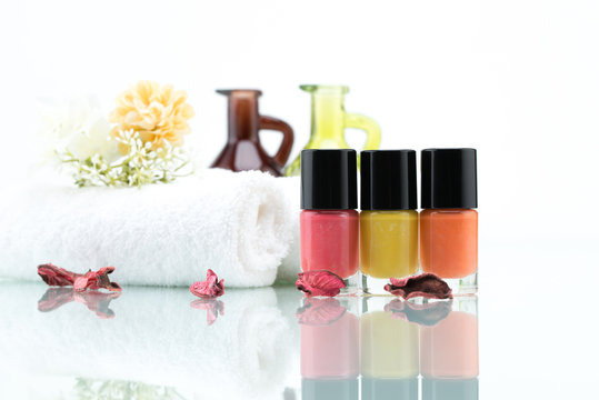 Colorful nail polishes and Dried Flowers