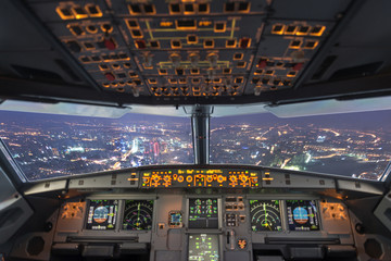 plane cockpit and city of night - 84975929