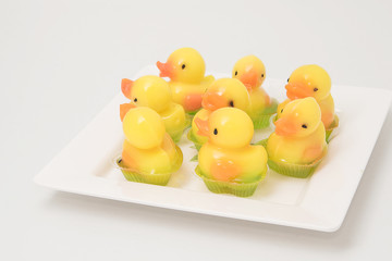 Coconut jelly yellow duck in white dish