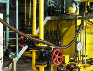 Modern boiler room equipment for heating system. Pipelines, water pump, valves, manometers.
