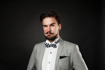 handsome guy with beard and mustache in suit