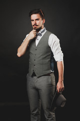 Obraz premium handsome guy with beard and mustache in suit